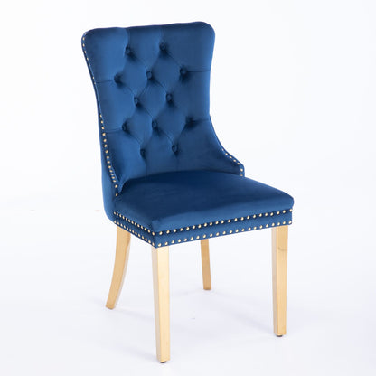 A pair of Nikki modern velvet dining chairs with tufted backs, nailhead trim, and gold stainless steel-plated legs are shown against a plain white background.