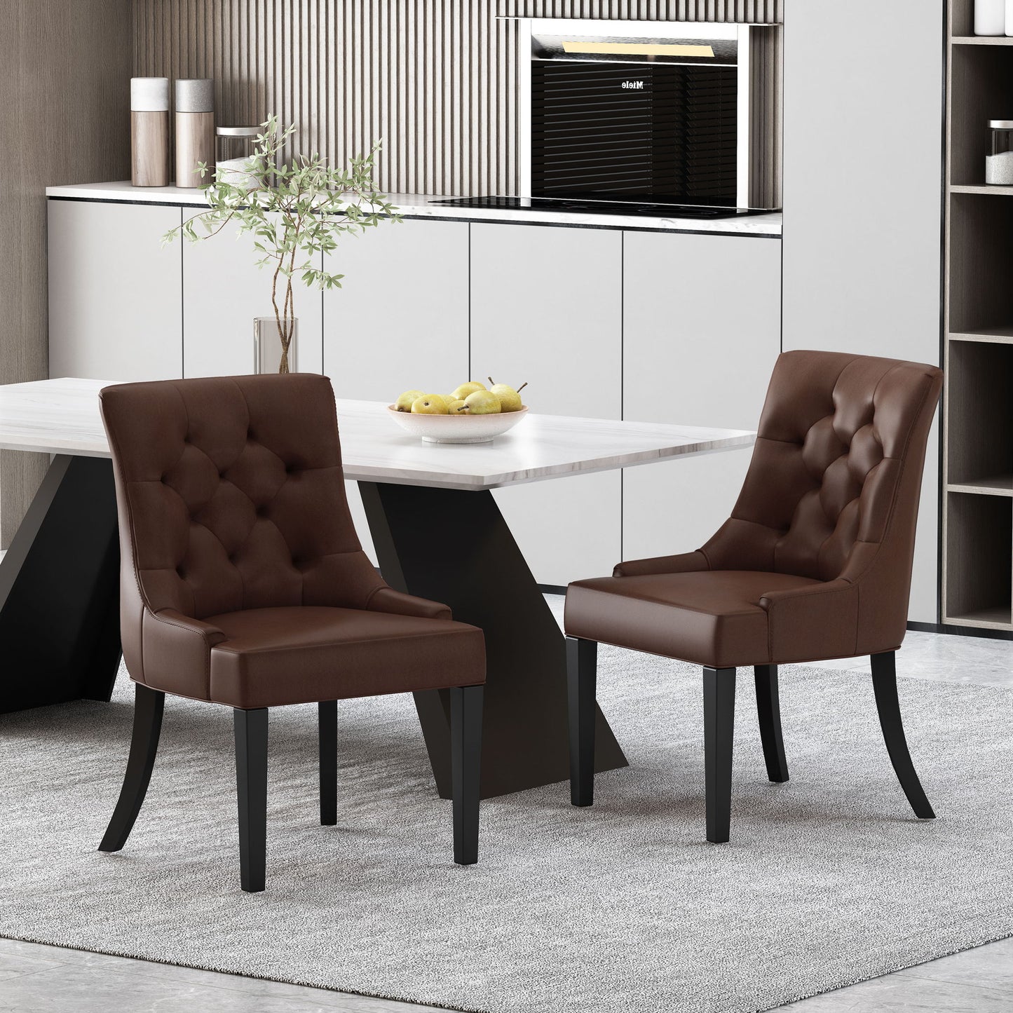 Two Cheney Contemporary Dining Chairs with tufted upholstery stand around a modern light-colored dining table, accented by minimalist decor, a plant, and a bowl of lemons on a light gray rug.