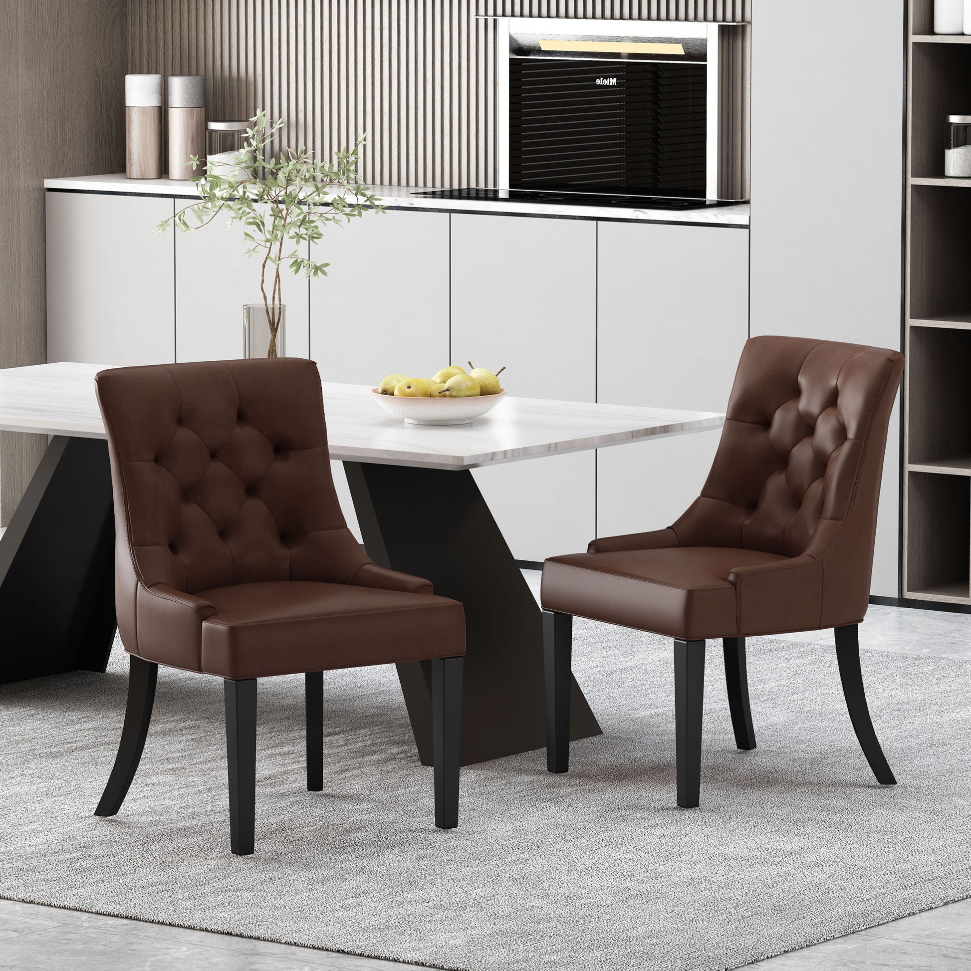 Two Cheney Contemporary Dining Chairs with tufted upholstery stand around a modern light-colored dining table, accented by minimalist decor, a plant, and a bowl of lemons on a light gray rug.