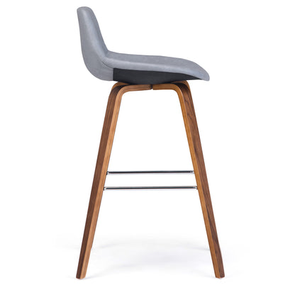 The Randolph Bentwood Counter/Bar Height Stool (Set of 2) features a curved gray cushioned seat, angled wooden legs, and two horizontal metal footrests. Shown in profile against a white background.