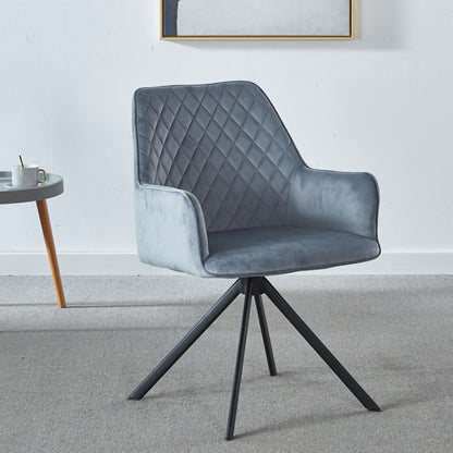 The Modern Desk Chair No Wheel, an ergonomic blue upholstered office chair with metal legs, sits on a gray carpet next to a small side table with a cup and saucer, positioned against a plain white wall.