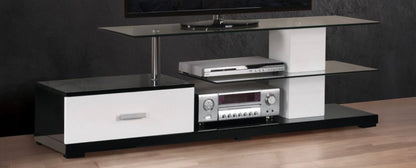 The Ivana TV Stand in white and black features glass shelves for a DVD player and stereo receiver, a left-side drawer, and is set on a wooden floor against a dark wall.