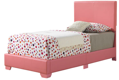 The Elegant Platform Bed For Relaxed Spaces features a pink single frame with a high headboard, red and purple polka dot bedding, a beige blanket, and two pillows.