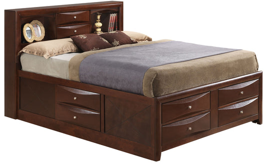 The Marilla Storage Bed with Bookcase Headboard features built-in side and footboard drawers, plus shelves for books and decor. It’s styled with brown and beige bedding and decorative pillows.