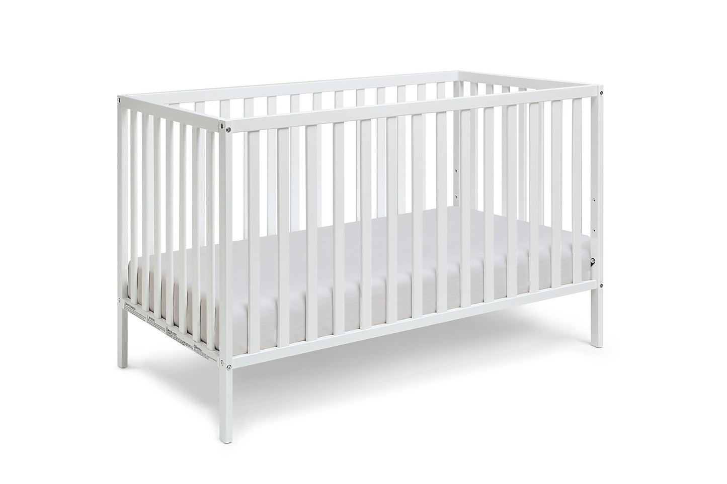 The Palmer - 3-in-1 Convertible Island Crib is a white wooden crib with vertical slats on all sides and a fitted white mattress, displayed against a plain white background.