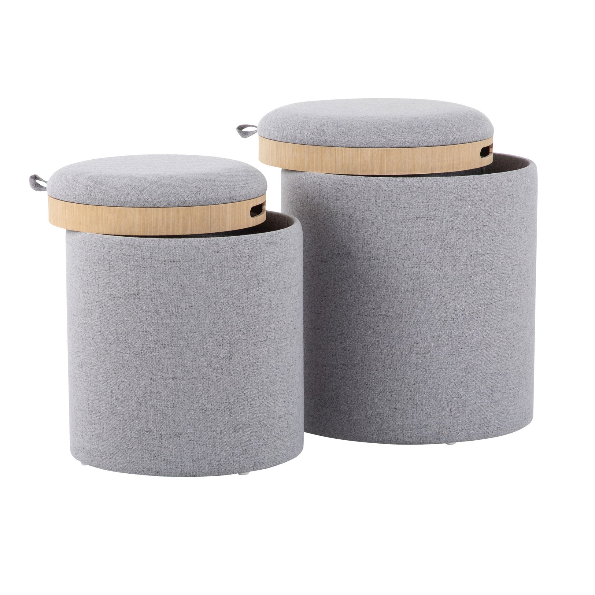The Tray - Contemporary Nesting Ottoman Set features two cylindrical, light grey upholstered storage ottomans of different heights with wooden lids and small fabric handles on the sides.