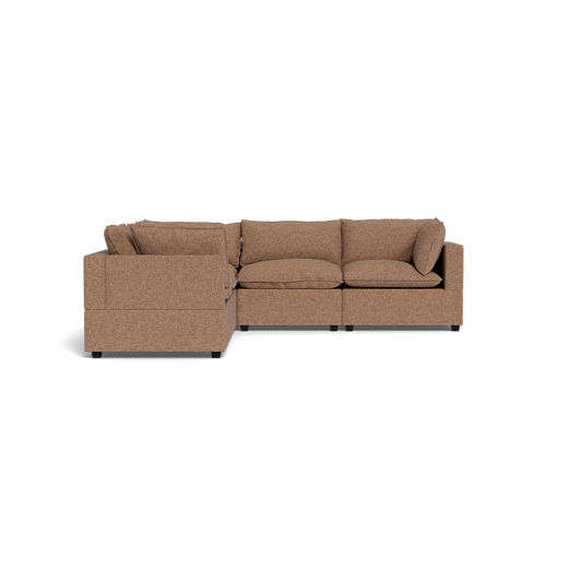 The Kova Pillow Cushion Corner Sectional is a brown L-shaped sofa with three seat cushions, three back cushions, and two side cushions, featuring low black legs and shown against a plain black background.