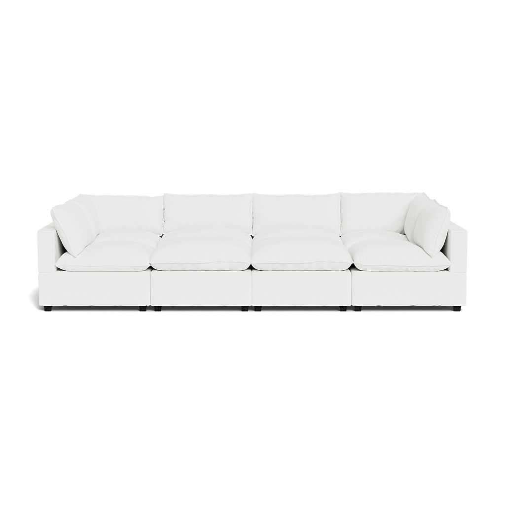 The Kova Pillow Cushion Grand Pit is a modern, white modular sectional sofa featuring five seats and plush cushions, shown from the front against a plain background.