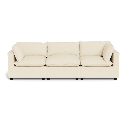 The Kova Pillow Cushion Sofa 122" is a modern cream-colored three-seater with square armrests and five back cushions, displayed against a plain white background.