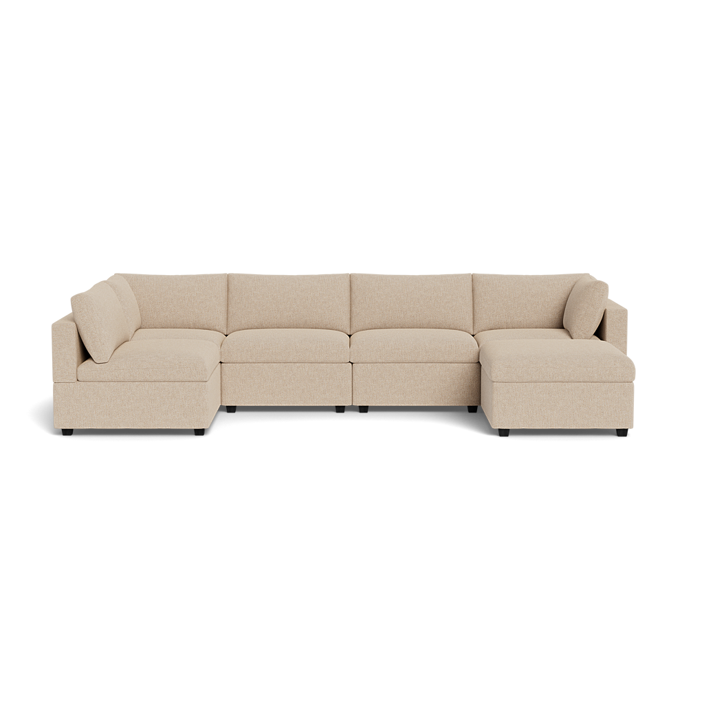 The Kova Box Cushion U-Shape is a beige, L-shaped sectional sofa with five seats and two corner cushions, displayed against a plain white background.
