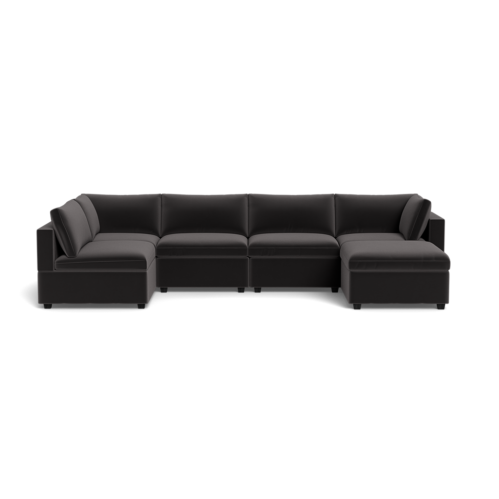 The Kova Box Cushion U-Shape is a modern black sectional sofa with wide cushions and low armrests, shown from the front on a plain, transparent background.