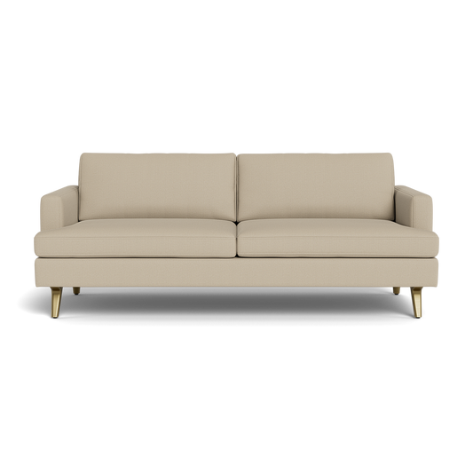 The Lido Sofa 75" is a modern beige sofa featuring two seat cushions, two back cushions, short armrests, and gold-colored angled legs, all set against a plain black background.