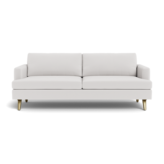 The Lido Sofa 75" is a modern white sofa with two seat cushions, two back cushions, low armrests, gold-colored angled legs, and a clean minimalist design.