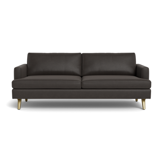 The Lido Sofa 75" is a modern dark gray sofa featuring two seat cushions, two back cushions, slim square armrests, and short gold metal legs, displayed against a plain black background.