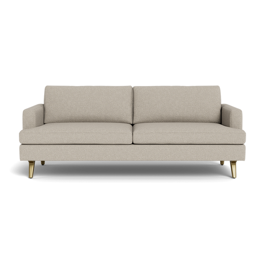 The Lido Sofa 75" is a modern beige fabric sofa with two seat and back cushions, low armrests, and four angled gold legs, shown from the front against a plain black background.