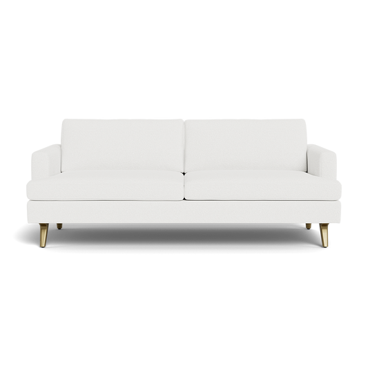 The Lido Sofa 75" is a modern white sofa featuring two seat cushions, two back cushions, and short gold legs, set against a plain black background.