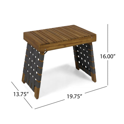 The Outdoor Wooden Foldable Side Table - Teak features a slatted top, angled legs wrapped in black webbing, and measures 19.75" wide by 13.75" deep by 16" high.