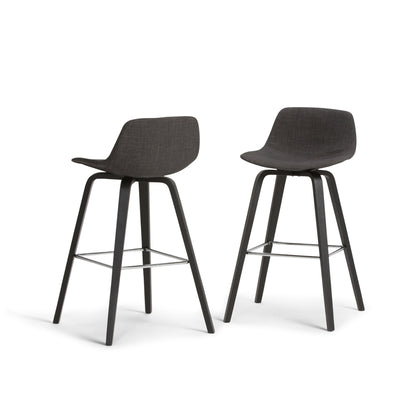 The Randolph Bentwood Counter/Bar Height Stool set includes two modern black stools with curved seats, low backrests, four angled legs each, and metal footrests, displayed side by side on a white background.