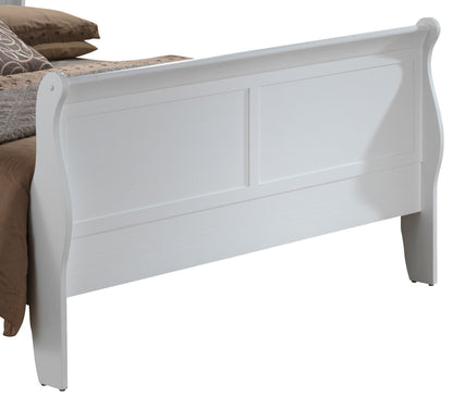 The Panel Sleigh Bed features a white wooden sleigh-style footboard with clean lines and panel detailing, shown partially attached to a bed with brown and beige bedding.