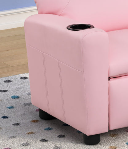 A close-up of the Marisa - PU Leather Kids Recliner Chair With Cupholder in pink, featuring a built-in black cup holder on the armrest, placed on a light gray rug with colorful dots and a light wood floor in the background.