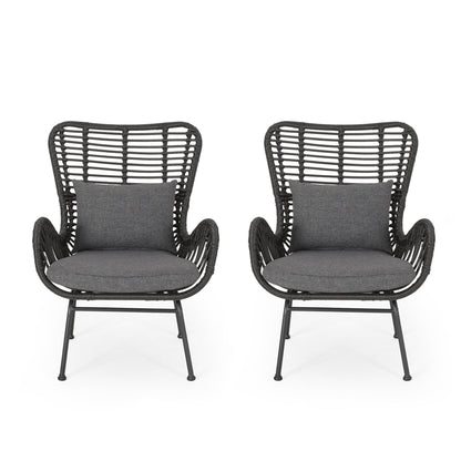 Two Modern Aesthetic Outdoor Rattan Accent Chairs with high backs, armrests, dark gray cushions, and matching rectangular pillows are displayed side by side on a white background.