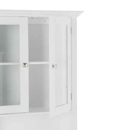 The Acadian Space Saver Cabinet in Pure White features a glass-paned door, empty shelves inside, silver square knobs, and a clean, modern design.