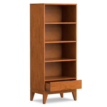 The Harper - Handcrafted Bookcase With Storage features a smooth, mid-century modern design with four open shelves, a partially open bottom drawer, and angled legs.