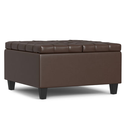 The Harrison Large Coffee Table Storage Ottoman is a square, brown, tufted leather piece with short black legs, displayed on a white background.