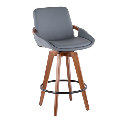 The Cosmo - Mid Century Counter Stool features light brown wooden legs, a circular black metal footrest, cushioned gray upholstery on the seat and backrest, armrests, and a swivel design.