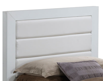 A close-up of the Transitional Modern Design Bed's white headboard featuring three horizontal padded panels, set behind a bed adorned with beige and gray pillows.