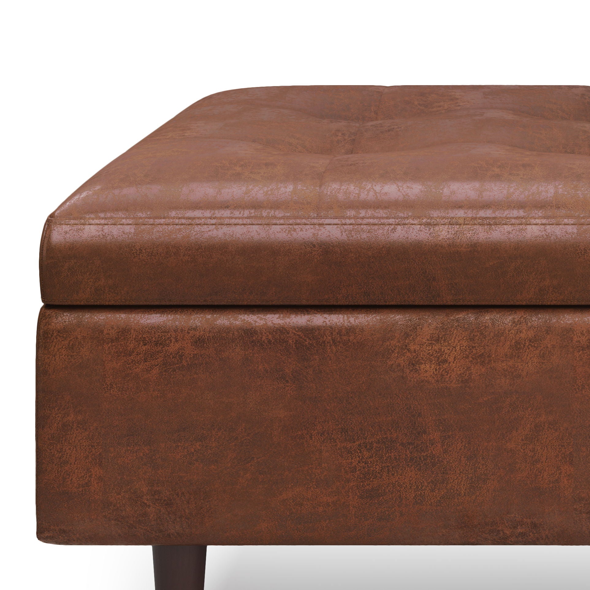 Close-up of the Shay Large Square Coffee Table Storage Ottoman in brown faux leather with a cushioned top and wooden legs, mid-century style, shown against a plain white background.