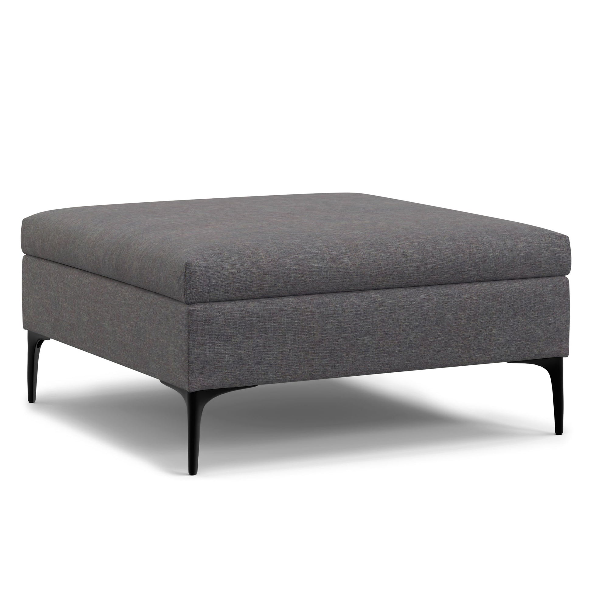 The Rebecca is a modern square storage ottoman coffee table with dark gray fabric upholstery, black metal legs, and a lift-up lid, shown against a white background.