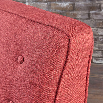 Close-up of the backrest of the Mid-Century Modern Recliner With Button Tufted Waffle Stitch in red upholstery, shown against a brown brick wall and wooden floor.