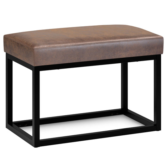 The Reynolds Small Bench features a distressed chestnut brown cushioned seat and a black metal open-frame base, displayed against a white background.