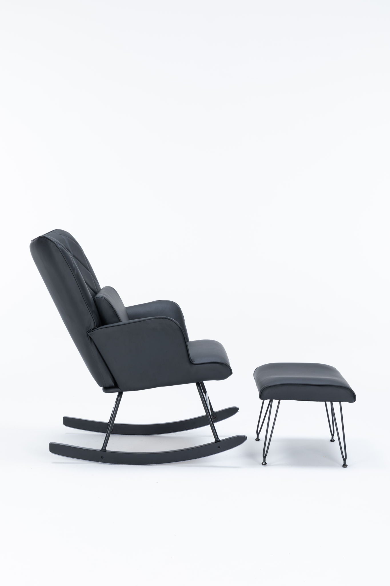 The Rocking Accent Chair With Lumbar Pillow And Ottoman features a modern black leather design with metal legs, paired with a matching ottoman, both set against a white background.