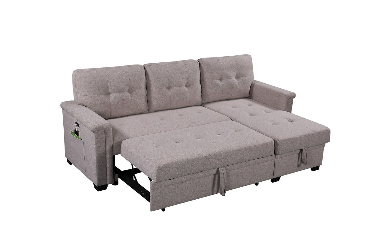 The Nathan Reversible Sleeper Sectional Sofa in light gray features tufted cushions, armrests with a side pocket, USB charging ports, a storage chaise, and converts easily into a bed.