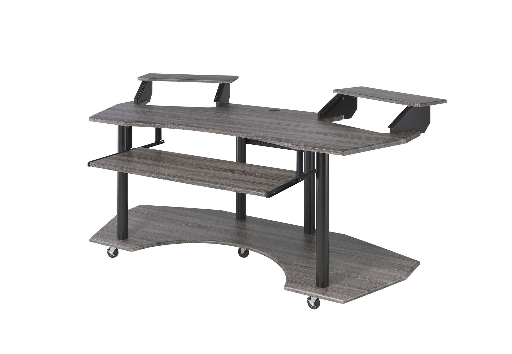 The Eleazar Music Recording Studio Desk features a modern gray wood design with two raised monitor shelves, a pull-out keyboard tray, a curved lower shelf, black metal legs, and four caster wheels for mobility.