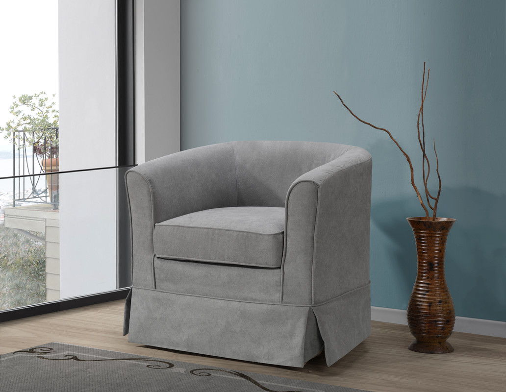 The Tucker Woven Fabric Swivel Barrel Chair in light gray sits beside a brown vase with branches, set against a blue wall near a large window overlooking the balcony.