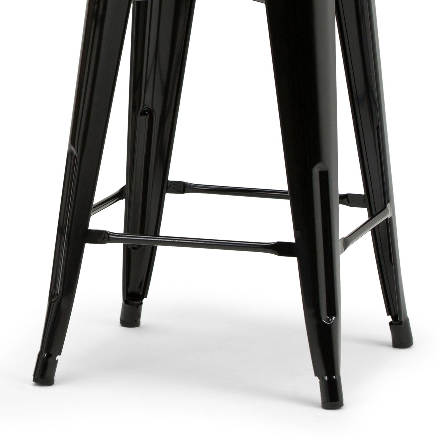 Close-up view of the black metal legs of the Rayne - Multifunctional Metal Stool, featuring crossbars for added support and stability, set against a white background.