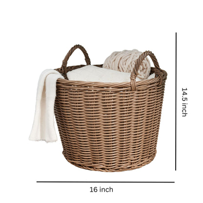 The Round Cone Woven Resin Wicker Basket With Handles for Versatile Storage in Walnut Brown measures 16" wide and 14.5" tall, and comes with two handles, a cream-colored blanket, and a knitted throw inside.