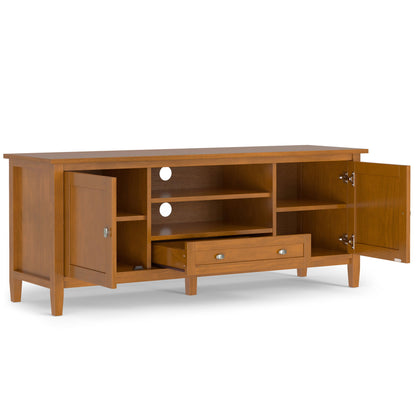 The Warm Shaker TV Media Stand in brown features tapered legs, two open center shelves with cable management, a pull-out drawer below, and side cabinets with silver knobs, displayed with doors and drawer open.