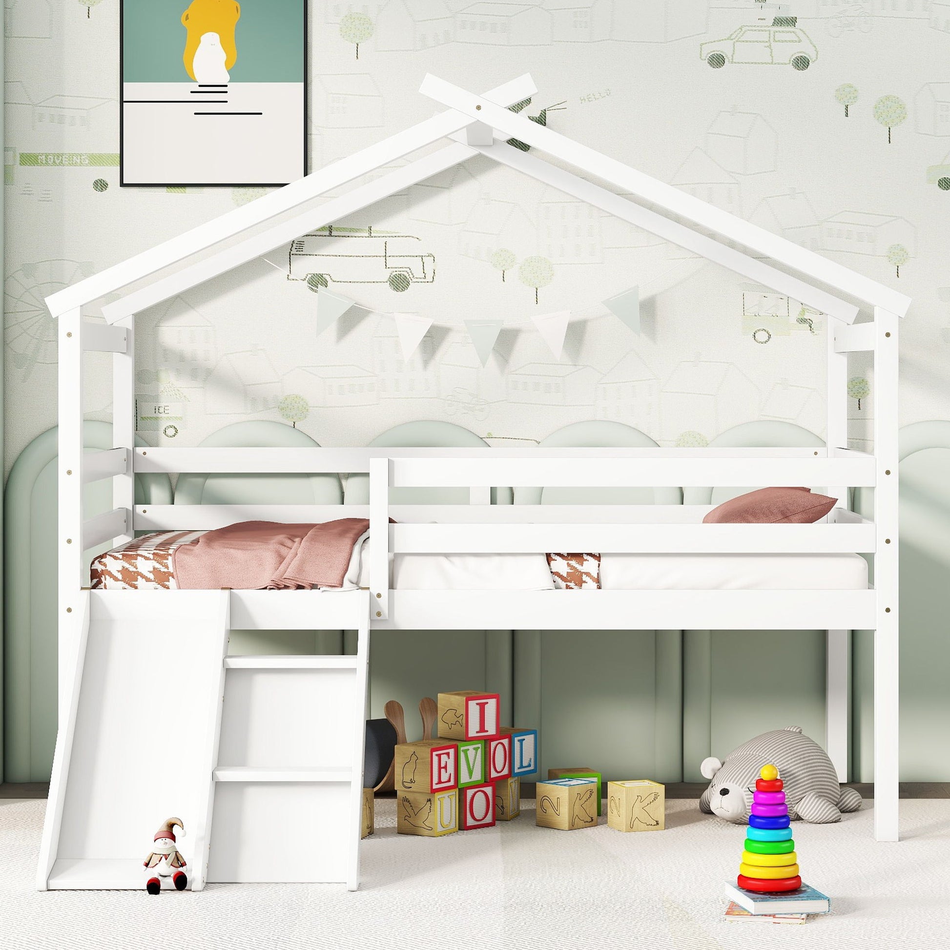 A white Low Loft House Bed With Slide, Ladder, Safety Guardrails, and House Roof Frame features pink bedding, geometric pillows, and a pastel mural wall. Below are wooden blocks, a teddy bear, rainbow stacker toy, doll, and hanging bunting.