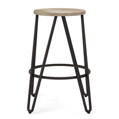 The Simeon Multifunctional Metal Stool features a round light wood seat, black metal legs, and a circular footrest for added stability.