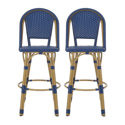The Outdoor Rattan And Aluminum French Barstools (Set of 2) feature tall frames with woven blue seats and backs, light brown legs, circular footrests, and blue accents. Both stools are placed side by side, facing forward.