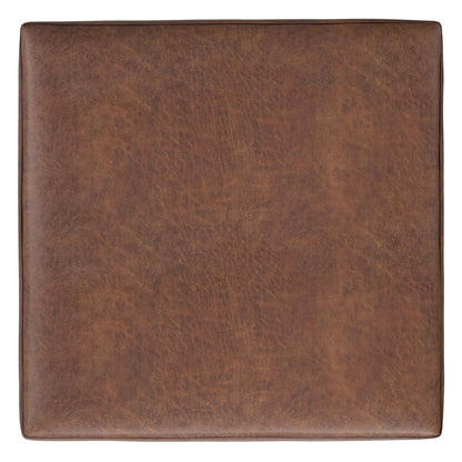 The Shiloh Multifunctional Square Storage Ottoman features brown leather with visible texture and subtle edge stitching, viewed from above.