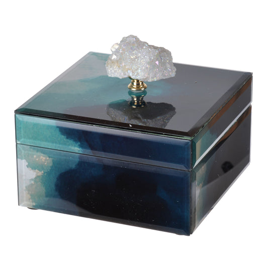 The Bethany - Aqua Jewelry Box is a square, mirrored, stackable storage box with blue and green hues and a clear crystal-like decorative knob lid.