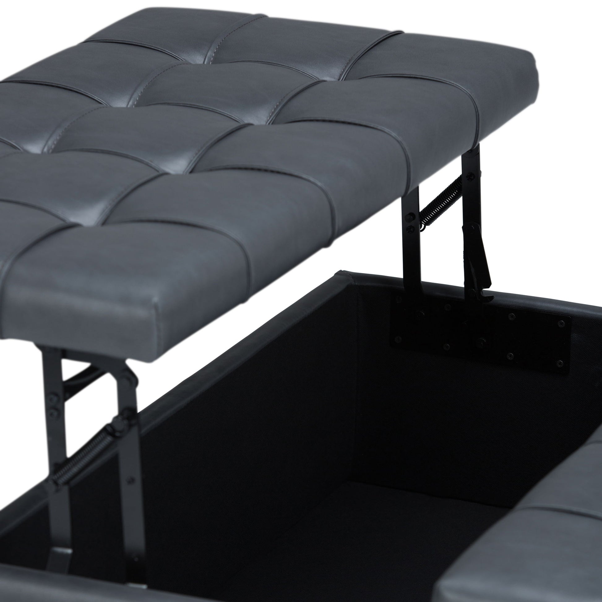 A close-up of the Harrison - Upholstered Coffee Table Storage Ottoman in tufted dark gray faux leather, with its hinged lid partially open to reveal a spacious storage compartment inside.