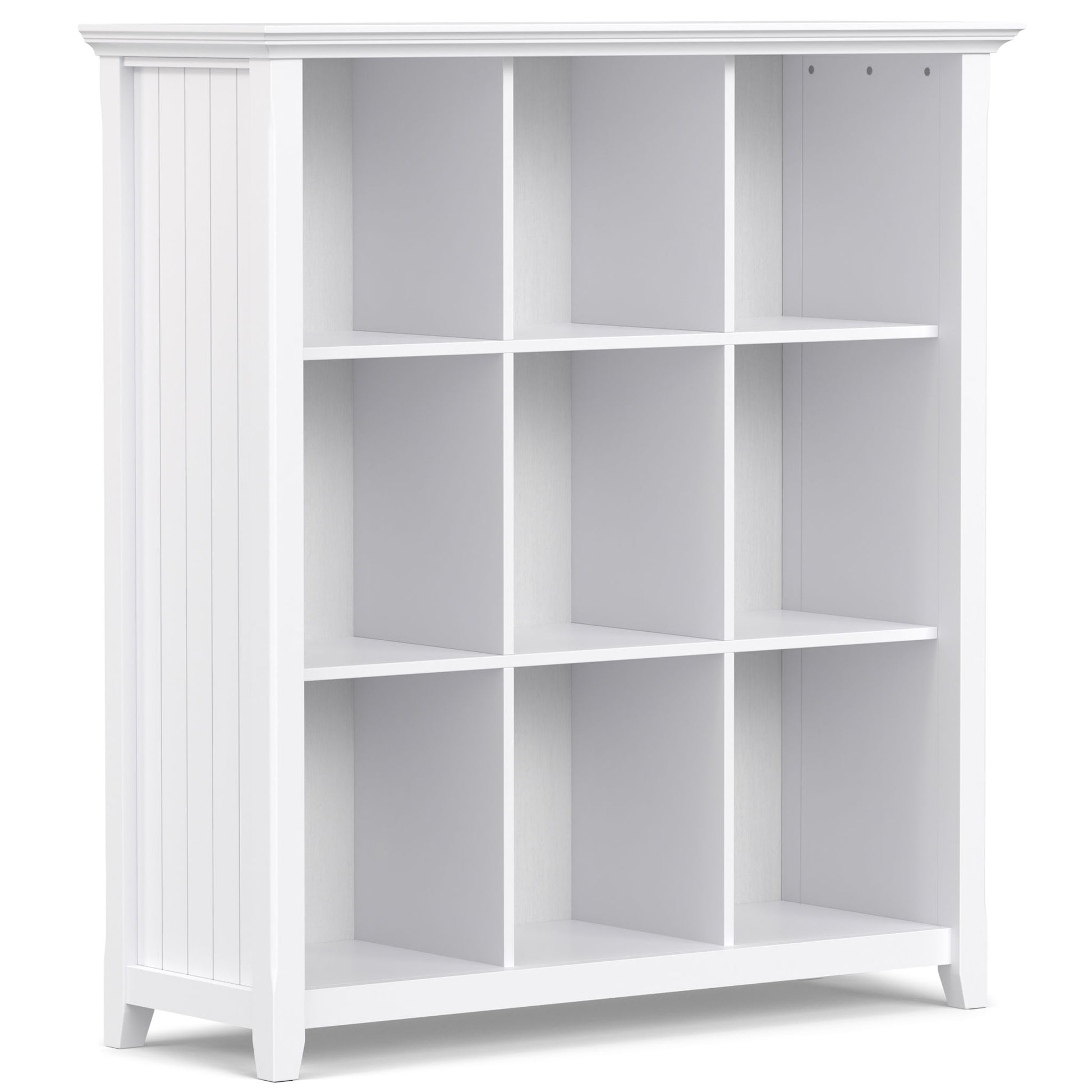 The Acadian - Handcrafted Cube Storage is a white wooden bookshelf with nine square compartments in a 3x3 grid, vertical side grooves, and a smooth flat top.