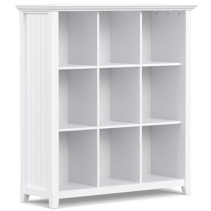 The Acadian - Handcrafted Cube Storage is a white wooden bookshelf with nine square compartments in a 3x3 grid, vertical side grooves, and a smooth flat top.
