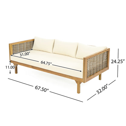 The Claremont 3 Seater Daybed features a teak and acacia wood frame, woven sides, water-resistant cream cushions, and measures 67.5" W x 32" D x 24.25" H with a seat depth of 31", width of 64.75", and height of 11".
